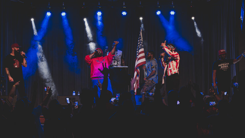 Conservative Billboard hip hop star Christopher “Topher” Townsend of Philadelphia performs while proudly displaying the U.S. flag.